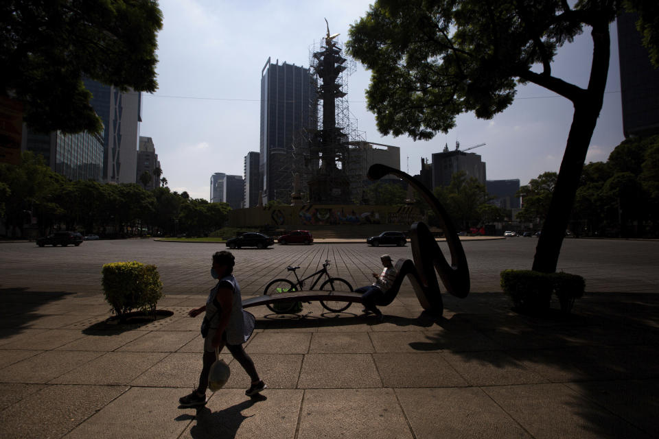 The street and pedestrian area around the Angel of Independence monument are almost empty in Mexico City, Tuesday, June 2, 2020, amid the new coronavirus pandemic. While the federal government’s nationwide social distancing rule formally ended Monday, it is urging people in so-called “red” zones to maintain most of those measures — and so many people are falling ill and dying each day that those zones cover nearly the whole country. (AP Photo/Fernando Llano)