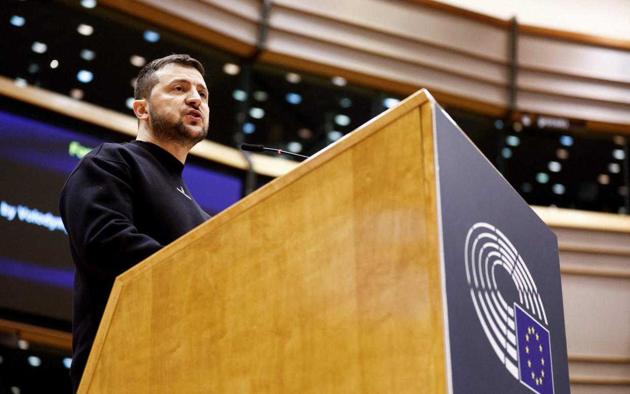 Ukraine's president Volodymyr Zelensky delivers a speech at the start of a summit at EU parliament in Brussels, - KENZO TRIBOUILLARD/AFP