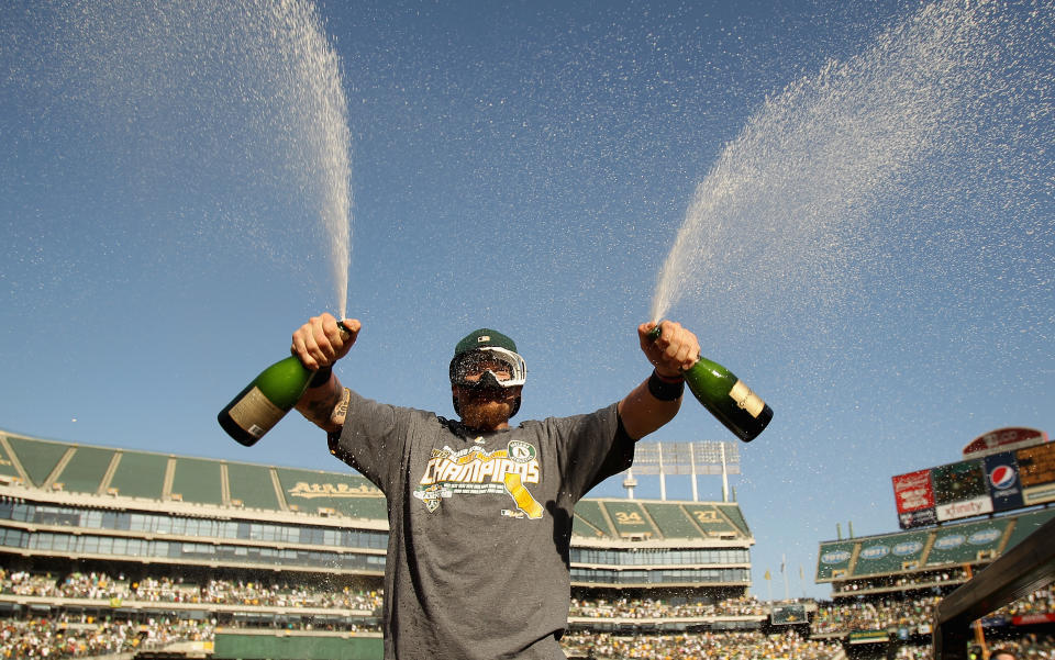 Jonny Gomes celebrates the A's AL West championship. (Getty)