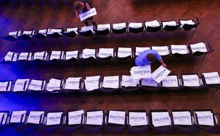 An assistant prepares placards with the names of Germany's Alternative for Germany (AfD) leader Frauke Petry, Matteo Salvini of the Northern League, France's National Front leader Marine Le Pen and Netherlands' Party for Freedom (PVV) leader Geert Wilders before the start of a European far-right leaders meeting to discuss about the European Union, in Koblenz, Germany, January 21, 2017. REUTERS/Wolfgang Rattay