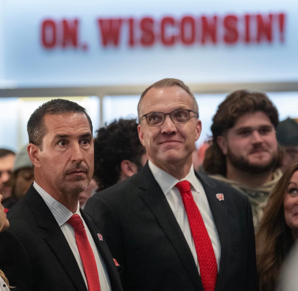 Chris McIntosh, center, became athletic director at Wisconsin the same day Name, Image and Likeness opportunities went into affect in college athletics.