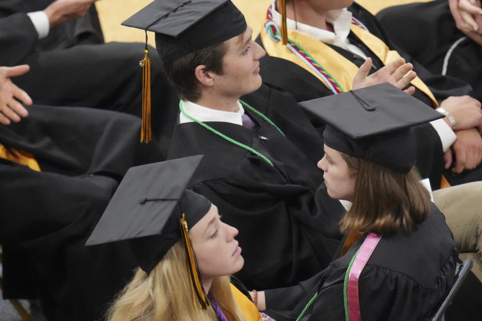 Students turn their chairs away from former U.S. Rep. Liz Cheney, R-Wyo., as she delivers the commencement address at Colorado College, Sunday, May 28, 2023, in Colorado Springs, Colo. (AP Photo/Jack Dempsey)