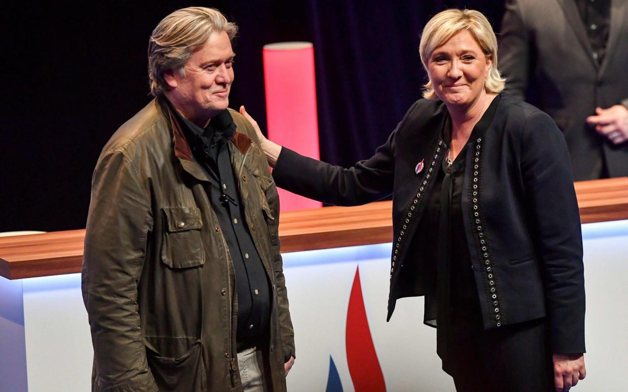 Marine Le Pen congratulates Mr Bannon after his speech - AFP