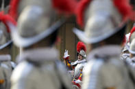 <p>A Vatican Swiss Guard recruit swears in during a ceremony at the San Damaso courtyard in Vatican City, May 6, 2017. The ceremony is held each May 6 to commemorate the day in 1527 when 147 Swiss Guards died protecting Pope Clement VII during the Sack of Rome. (Photo: Andrew Medichini/AP) </p>