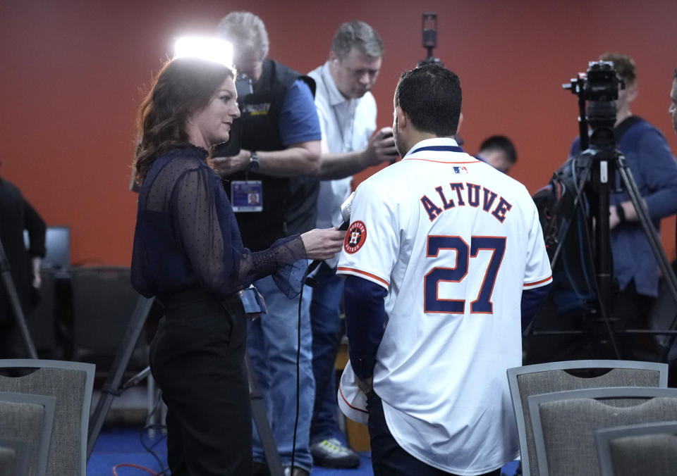 Houston Astros Jose Altuve is interviewed by Julia Morales after a press conference announcing they agreed to a five-year contract extension for him at Minute Maid Park on Wednesday, Feb. 7, 2024, in Houston. Altuve and the Houston Astros agreed to a $125 million, five-year contract that covers 2025-29. Houston announced a new multiyear deal for Altuve on Tuesday without disclosing financial details. (Karen Warren/Houston Chronicle via AP)