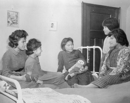 Girls sit on beds in a dormitory at the Shingwauk Indian Residential School in Sault Ste Marie, Ontario in a 1960 archive photo. REUTERS/Department of Citizenship and Immigration-Information Division/Library and Archives Canada/PA-185528/handout