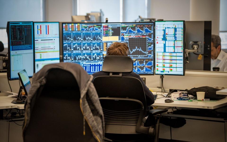 An employee working on the trading floor at the Citigroup offices in Paris - Benjamin Girette/Bloomberg