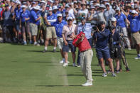 Australia's Adam Scott plays an approach shot on the 18th hole as the gallery look on during the Australian Open golf championship at Victoria golf course in Melbourne, Australia, Sunday, Dec. 4, 2022. (AP Photo/Asanka Brendon Ratnayake)