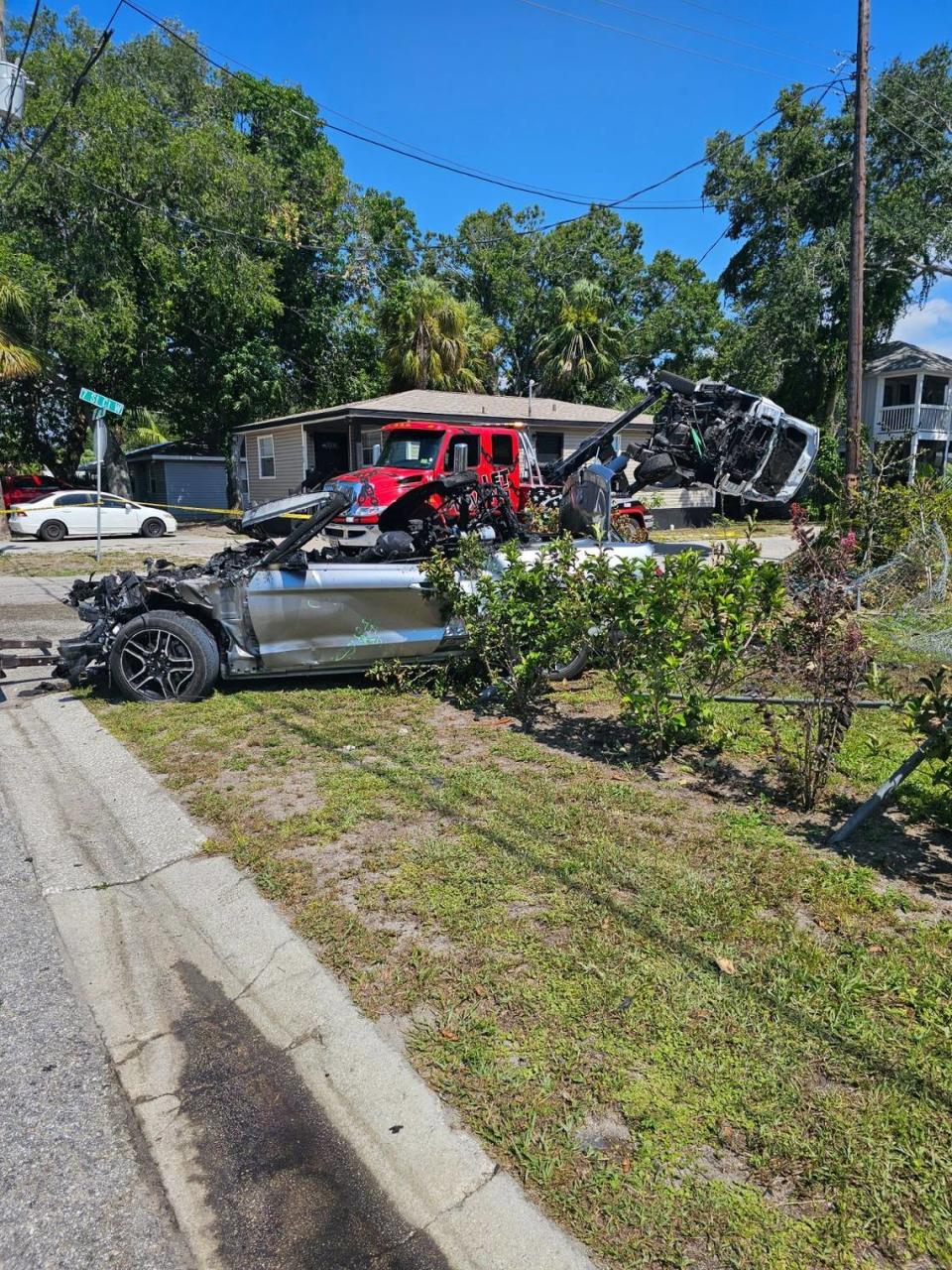 Bradenton police say two stolen vehicles crashed in the 700 block of 12th Ave. W., with one engulfed in flames and the other on its side after hitting the roof of a home.