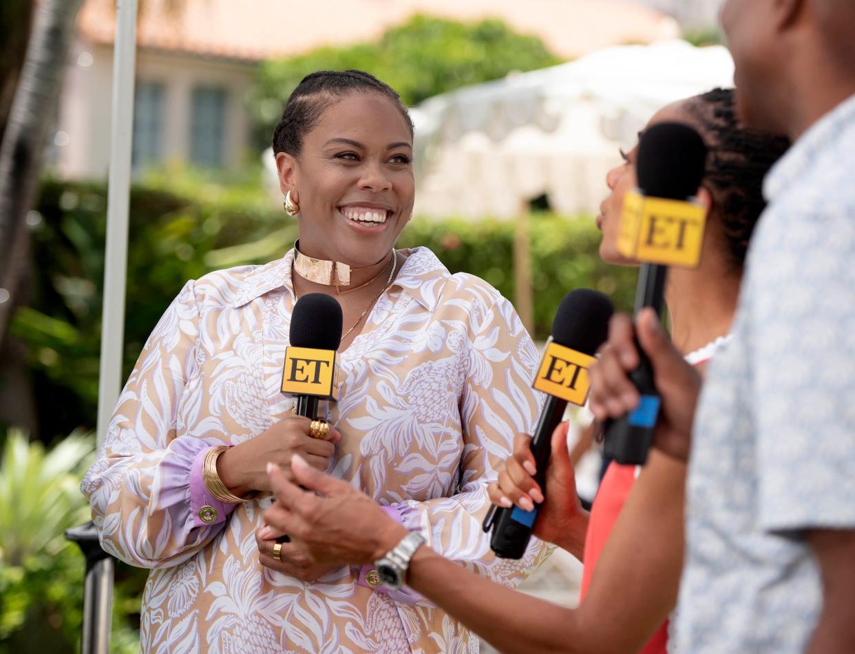 Amber Chardae Robinson of "Palm Royale," left, speaks to "Entertainment Tonight" co-hosts Nischelle Turner and Kevin Frazier during a taping of ET at The Colony Hotel on July 25, 2024 in Palm Beach.