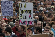 People take part in a 'We Do Not Consent' rally at Trafalgar Square, organised by Stop New Normal, to protest against coronavirus restrictions, in London, Saturday, Sept. 26, 2020. (AP Photo/Frank Augstein)