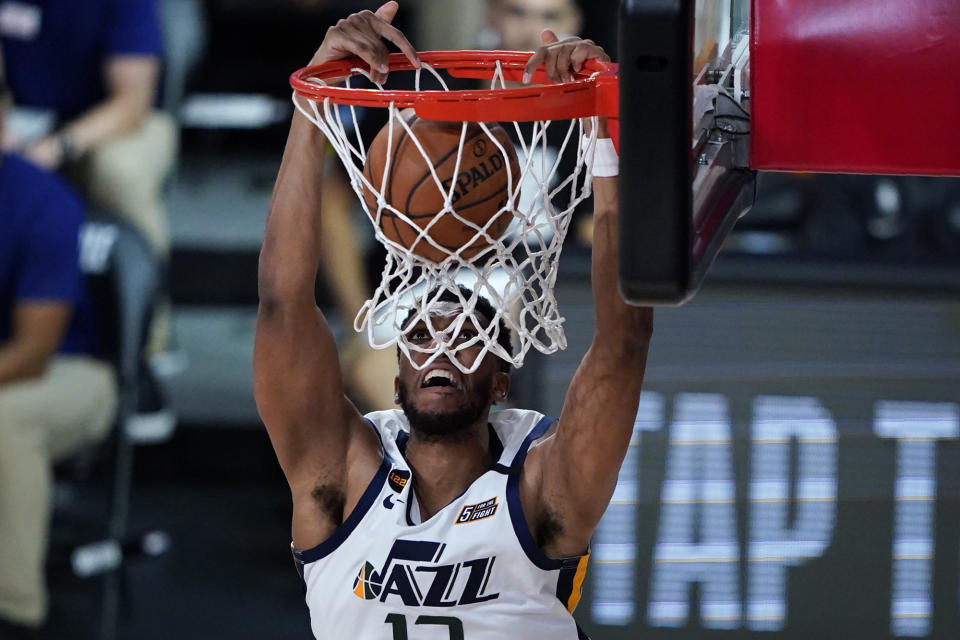 Utah Jazz's Tony Bradley (13) dunks against the Oklahoma City Thunder during the second half of an NBA basketball game Saturday, Aug. 1, 2020, in Lake Buena Vista, Fla. (AP Photo/Ashley Landis, Pool)