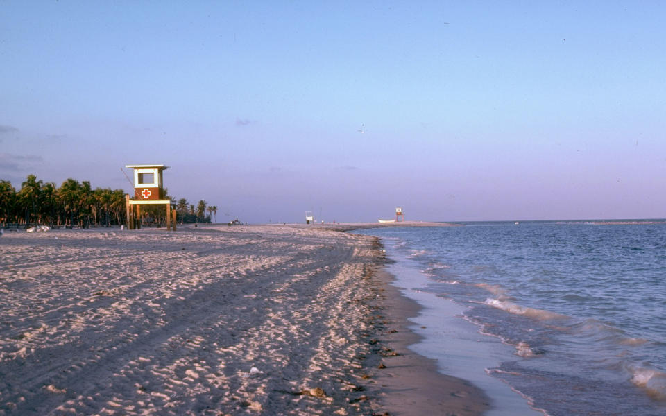 Dusk washes this quiet Floridian beach with dramatic shades of purple in the 70s.