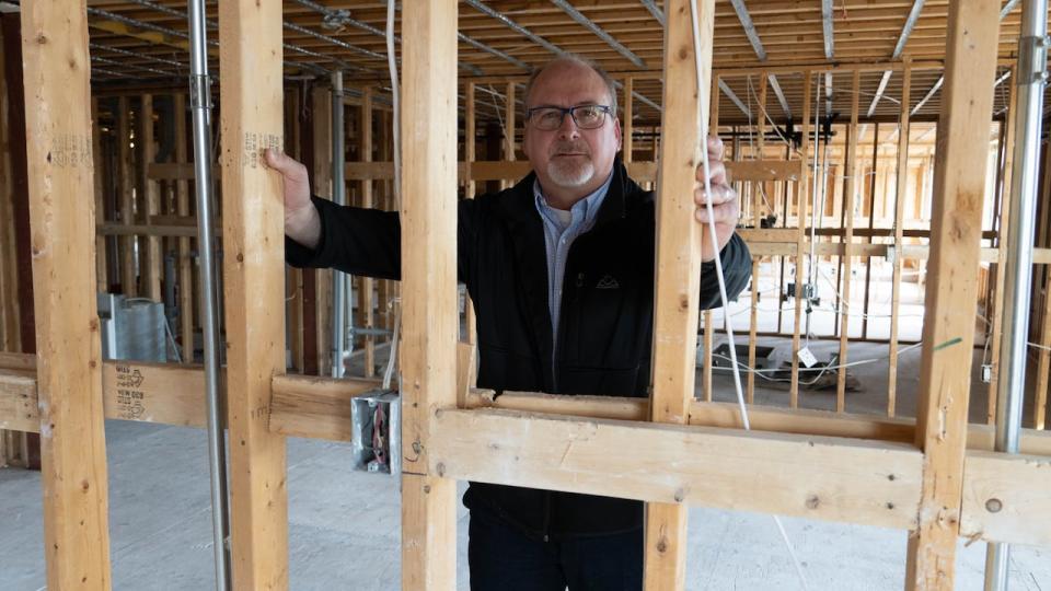 Salus Ottawa Executive Director Mark MacAulay stands on the gutted third floor of the Scott Street building. The demolition is expected to finish by the end of next week, when the renovations can begin.