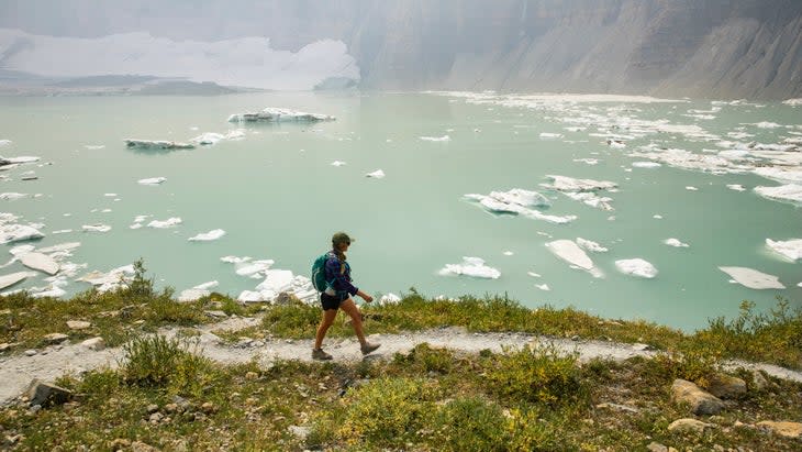Not all glacial hikes are treacherous. Here, a woman hikes on the Grinnell Glacier Trail where she will likely see some crevasses.