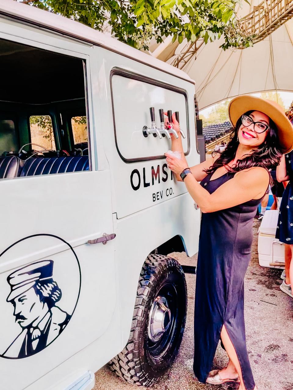 Jennifer Olmsted with her customized 1967 Toyota Land Cruiser tap truck pours drinks at a private event at World’s Fair Park, Aug. 13, 2020