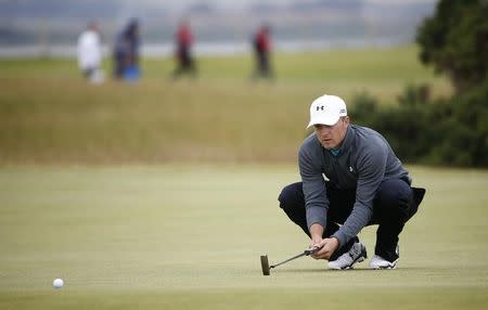Jordan Spieth of the U.S. lines up his putt on the sixth hole during the third round of the British Open golf championship on the Old Course in St. Andrews, Scotland, July 19, 2015. REUTERS/Eddie Keogh