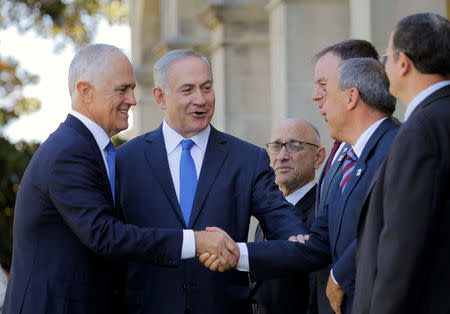 Israeli Prime Minister Benjamin Netanyahu (C) introduces Australian Prime Minister Malcolm Turnbull (L) to members of Netanyahu's delegation at Admiralty House in Sydney, Australia, February 22, 2017. REUTERS/Jason Reed