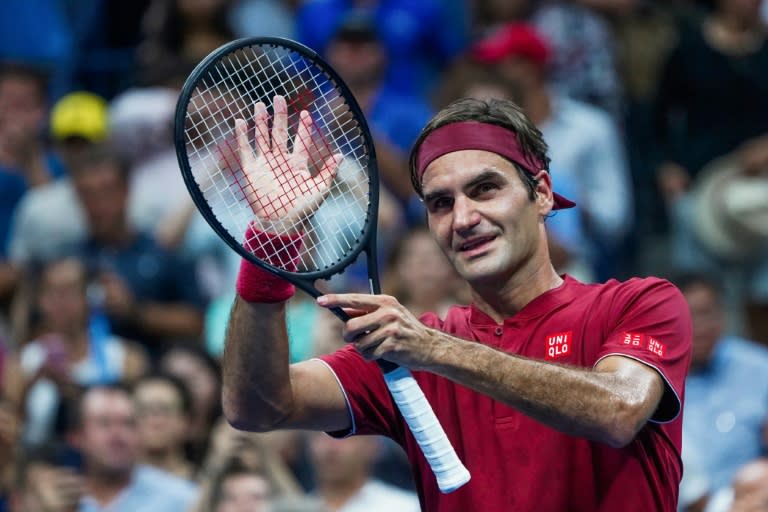 Roger Federer celebrates after defeating Yoshihito Nishioka in a US Open first-round match