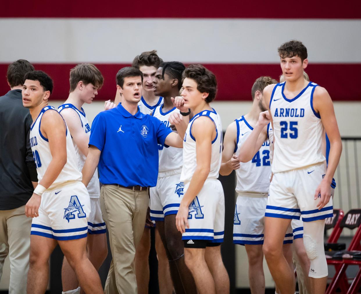 Arnold coach Josh Laatsch talks with his team during a timeout. Bay High hosted Arnold in a boys basketball game Friday, February 4, 2022. 