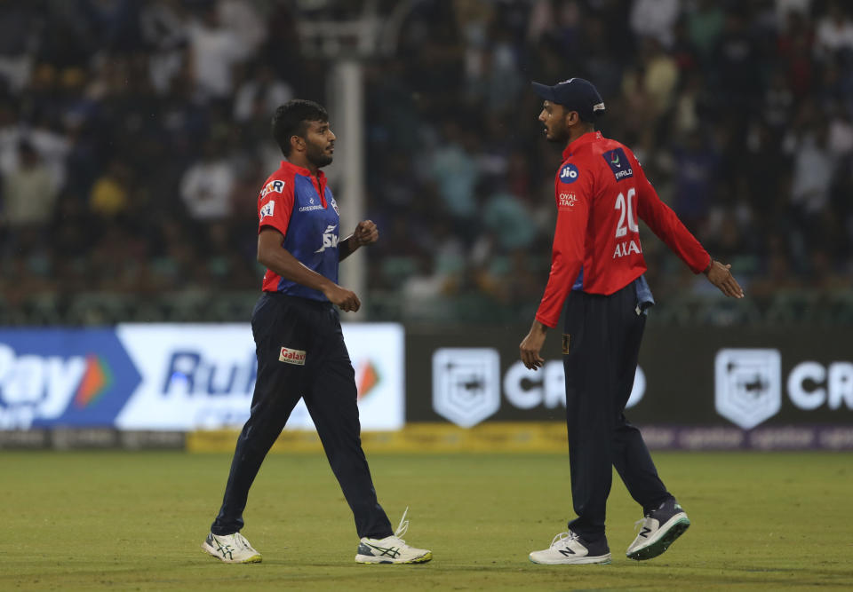 Chetan Sakariya of Delhi Capitals, left, and Axar Patel during the Indian Premier League cricket match between Delhi Capitals and Lucknow Super Giants in Lucknow, India, Saturday, April 1, 2023. (AP Photo/Surjeet Yadav)