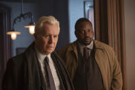 This image released by Netflix shows Gary Oldman, left, and Brian Tyree Henry in a scene from "The Woman in the Window." (Melinda Sue Gordon/Netflix via AP)