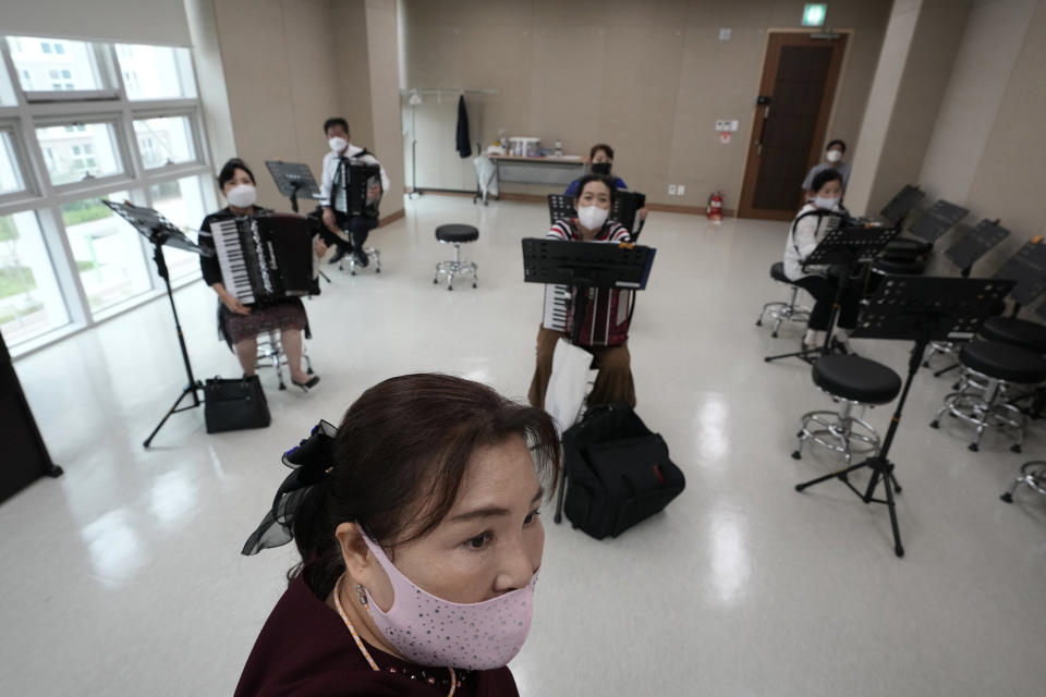 Ko Jeong Hee, bottom, a defector who teaches accordion, gives a lecture during the accordion class at the Inter-Korean Cultural Integration Center in Seoul, South Korea, on June 10, 2021. The center, which opened last year, is South Korea’s first government-run facility to bring together North Korean defectors and local residents to get to know each other through cultural activities and fun. It’s meant to support defectors’ often difficult resettlement in the South, but also aims at studying the possible blending of the rivals’ cultures should they unify. (AP Photo/Ahn Young-joon)