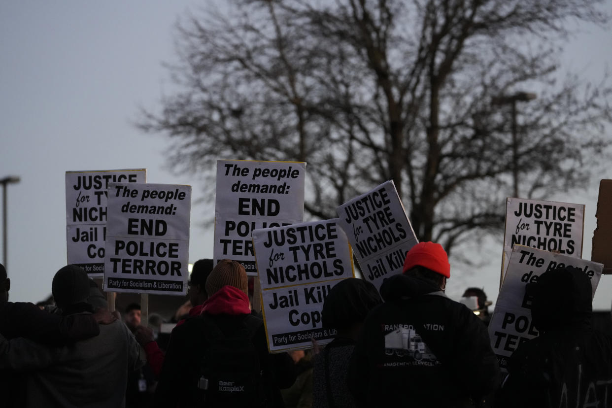 Protesters gather Friday, Jan. 27, 2023, in Memphis, Tenn., as authorities are set to release police video depicting five Memphis officers beating Tyre Nichols, whose death resulted in murder charges and provoked outrage at the country's latest instance of police brutality. (AP Photo/Gerald Herbert)