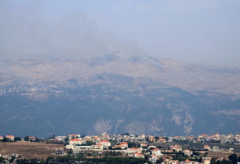 Smoke rises from the disputed Shebaa Farms area as seen from Marjayoun village