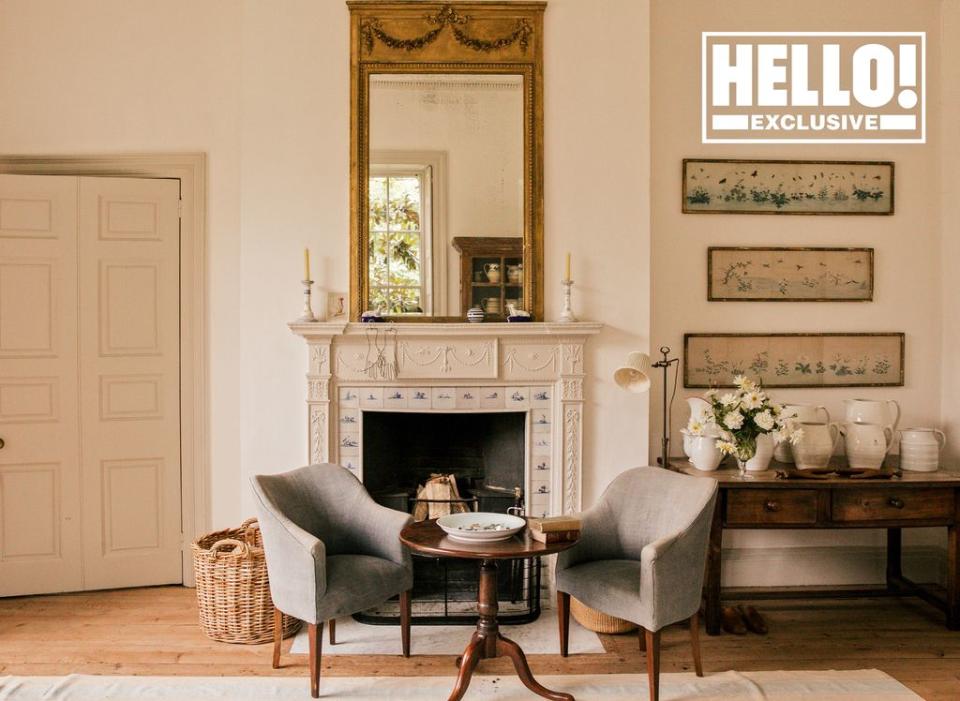 Conran home drawing room with gold mirror above fireplace