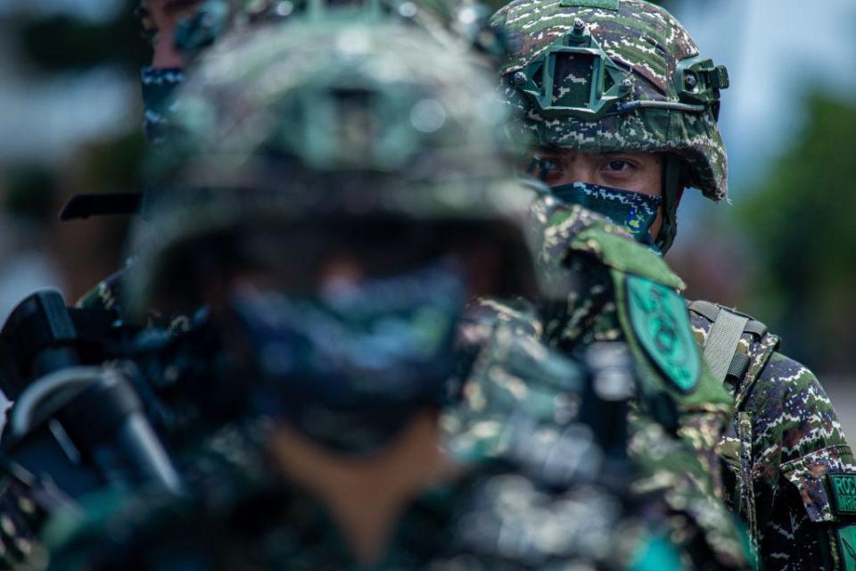 Taiwanese military personnel stand in a line during the Han Kuang military exercise, which simulates China's People's Liberation Army (PLA) invading the island on July 27, 2022 in New Taipei City, Taiwan