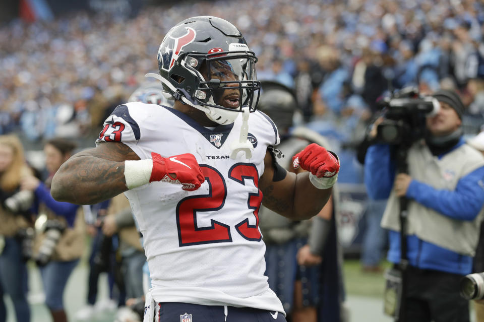 Houston Texans running back Carlos Hyde (23) celebrates after scoring a touchdown on a 10-yard run against the Tennessee Titans in the second half of an NFL football game Sunday, Dec. 15, 2019, in Nashville, Tenn. (AP Photo/James Kenney)