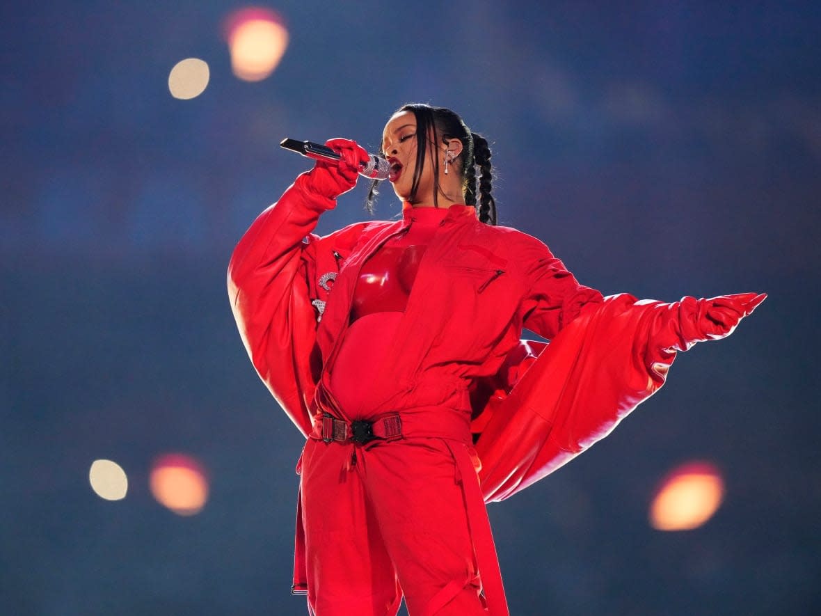 Rihanna performs during the halftime show at the 57th Super Bowl between Kansas City and Philadelphia on Sunday in Glendale, Ariz. (Matt Slocum/The Associated Press - image credit)