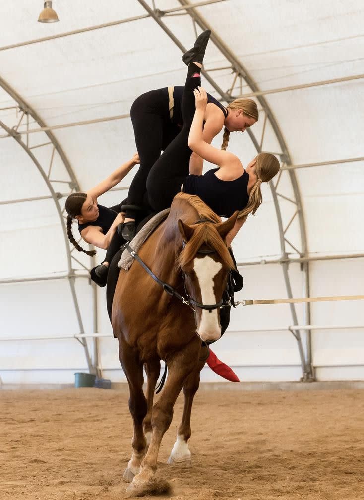 Left to right, Gracie Griffiths, Emma Wilson and Mikell Stoddard practice their routine on horse Cabo San Lucas at Oak Hills Vaulting in Salem on July 7. The team will represent the USA at the FEI Vaulting World Championships for Juniors and Young Vaulters, taking place in Sweden.