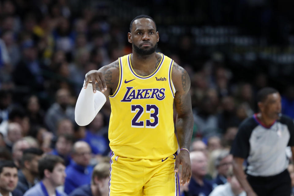 Los Angeles Lakers forward LeBron James celebrates his 3-pointer during the second half of the team's NBA basketball game against the Dallas Mavericks in Dallas, Friday, Nov. 1, 2019. (AP Photo/Tony Gutierrez)