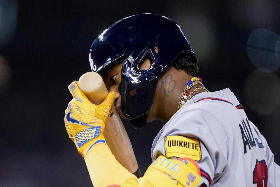 Atlanta Braves' Ronald Acuña Jr. touches his bat to his face during a third-inning at-bat in the team's baseball game against the Washington Nationals at Nationals Park, Thursday, Sept. 21, 2023, in Washington. (AP Photo/Andrew Harnik)