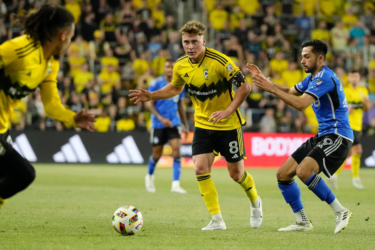 Apr 27, 2024; Columbus, Ohio, USA; Columbus Crew midfielder Aidan Morris (8) passes around CF Montreal midfielder Mathieu Choiniere (29) during the second half of the MLS match at Lower.com Field. The teams played to a 0-0 draw.