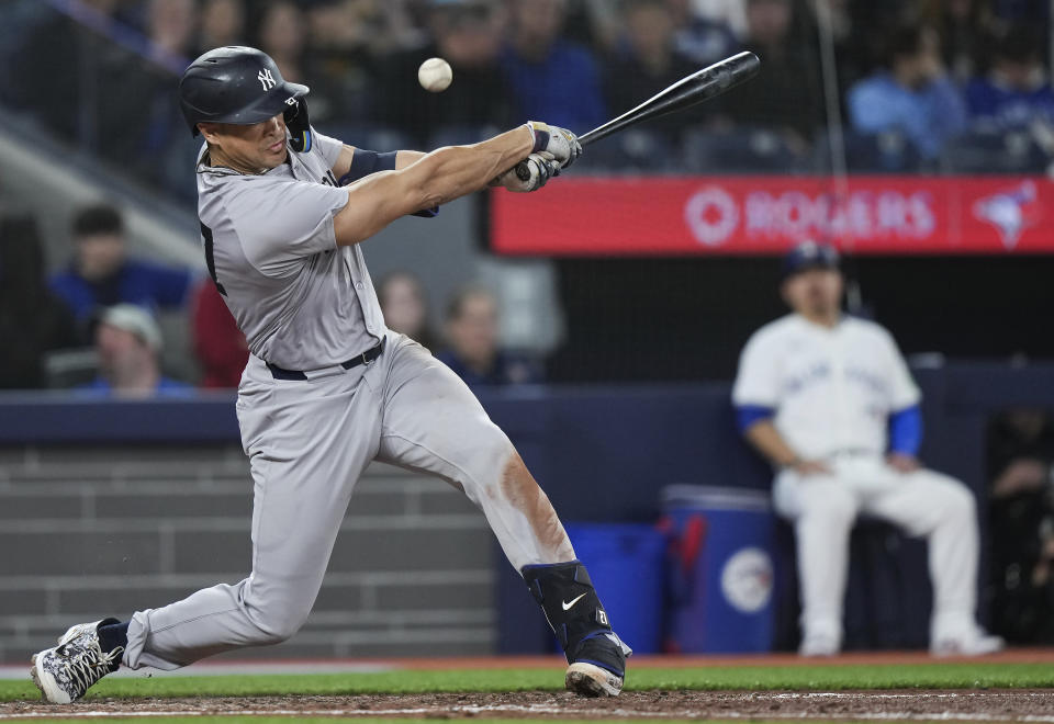 New York Yankees designated hitter Giancarlo Stanton grounds out during the fourth inning of a baseball game against the Toronto Blue Jays in Toronto on Tuesday, April 16, 2024. (Nathan Denette/The Canadian Press via AP)