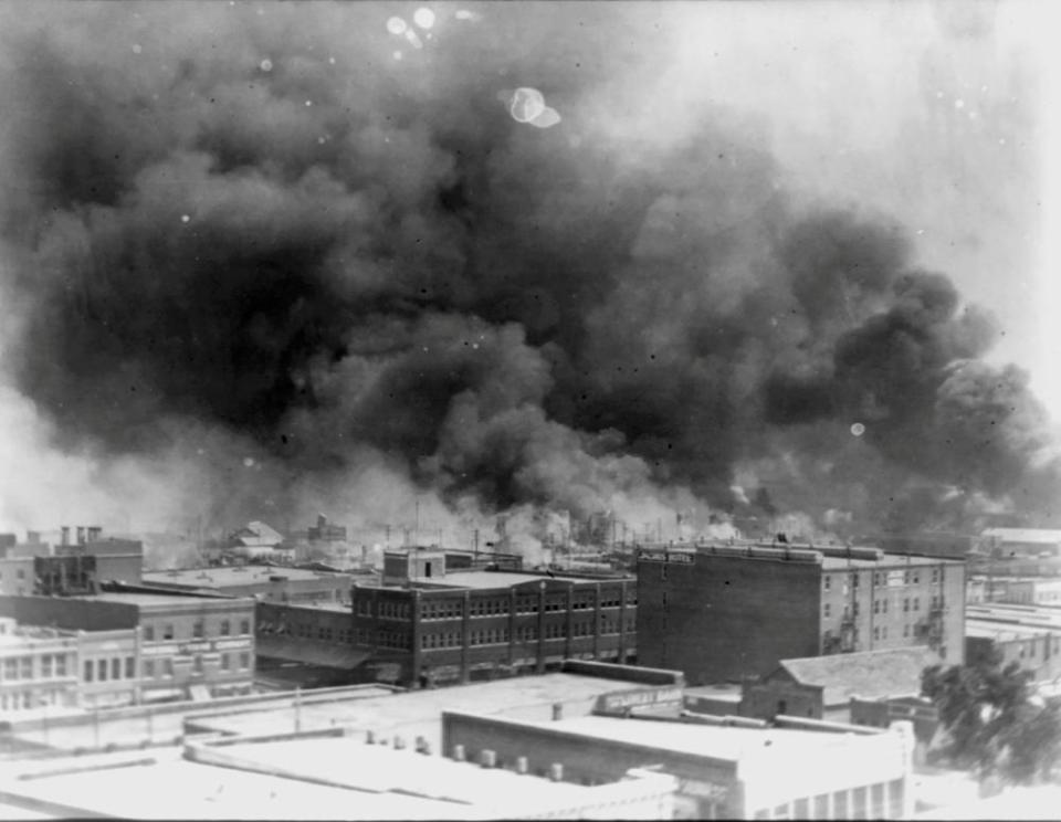 Smoke rises from buildings during the 1921 race riot in Tulsa, Oklahoma.