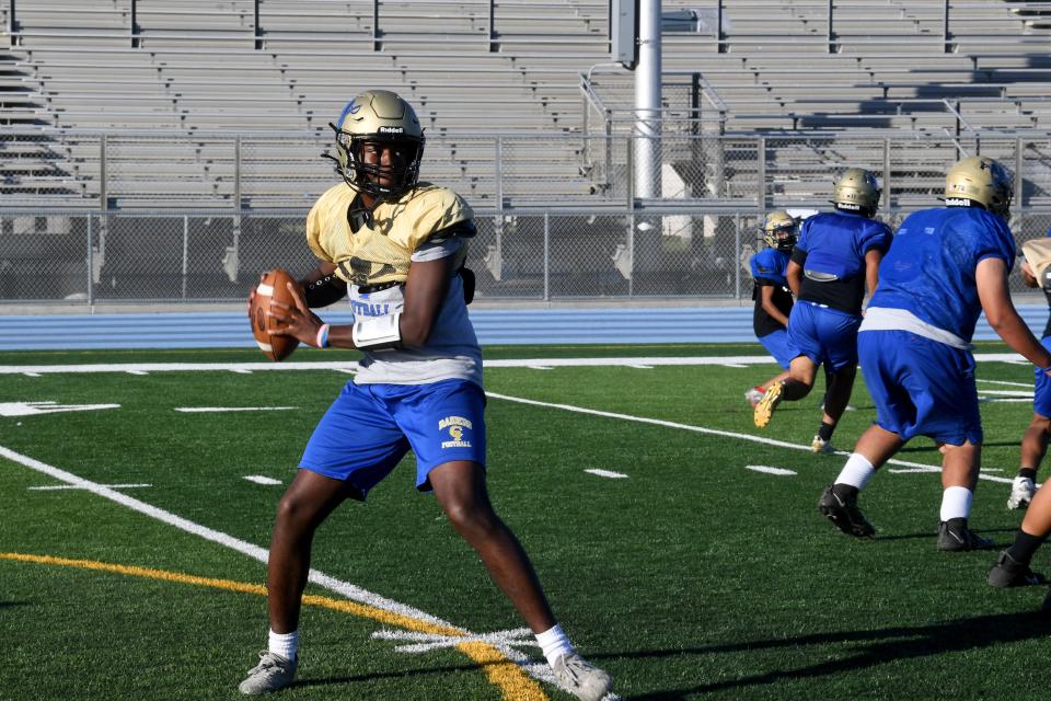 Quarterback Da'shaye Williams prepares to pass the ball during a Channel Islands High football practice on Oct. 24. Williams, a senior basketball player, was recruited on campus to play quarterback for the first time.