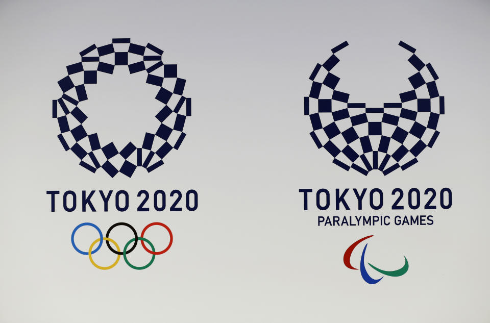 FILE - In this April 25, 2016, file photo, official logos of the 2020 Tokyo Olympics, left, and the 2020 Tokyo Paralympic Games are displayed by the Tokyo Organizing Committee, in Tokyo. Tokyo’s Olympic marathons and race walks, which moved last month to the northern city of Sapporo to avoid the capital’s summer heat, is likely to start and finish in the city’s Odori Park according to officials Monday. (AP Photo/Shizuo Kambayashi, File)