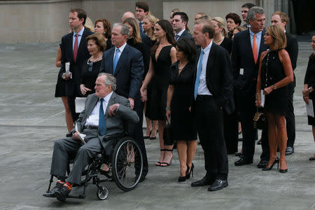 Former U.S. President George H.W. Bush attends the funeral service for his wife, former first lady Barbara Bush, with his son the 43rd U.S. President George W. Bush at St. Martin's Episcopal Church in Houston, Texas, U.S., April 21, 2018. REUTERS/Richard Carson