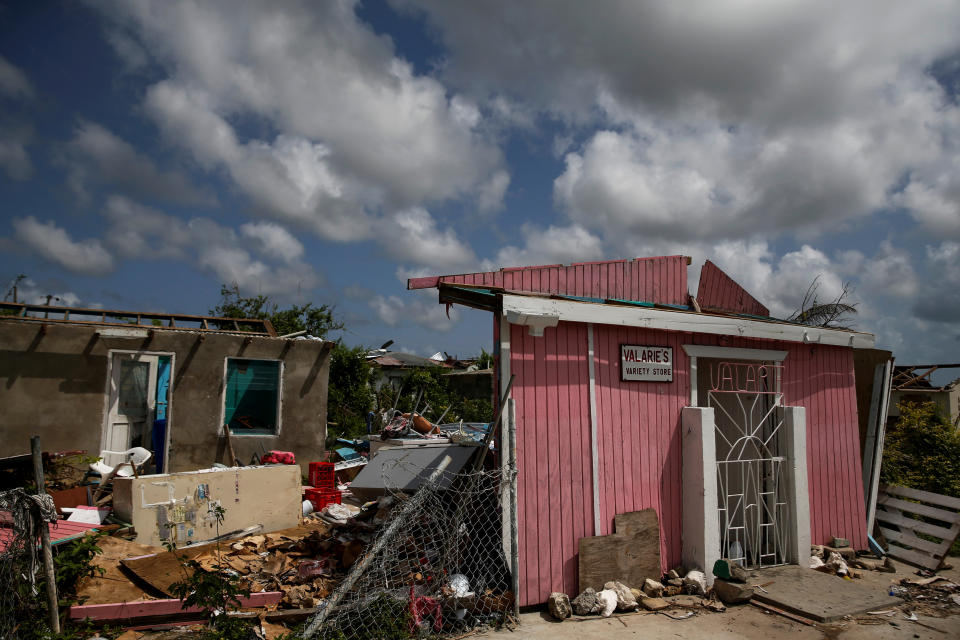 Homes sit in ruins at Codrington on the island of Barbuda just after a month after Hurricane Irma struck the Caribbean islands of Antigua and Barbuda