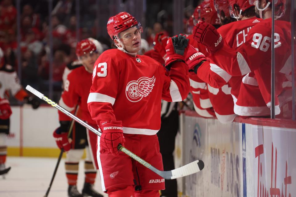 Red Wings forward Alex DeBrincat celebrates his goal in the third period of the Wings' 4-3 loss to the Ducks on Monday, Dec. 18, 2023, at Little Caesars Arena.