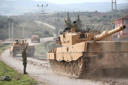 A Turkish military convoy arrives at a village on the Turkish-Syrian border in Kilis province, Turkey, January 21, 2018. REUTERS/Stringer