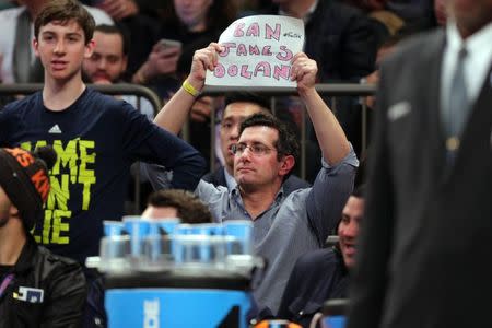 Feb 10, 2017; New York, NY, USA; A fan holds a sign directed at New York Knicks owner James Dolan during the second quarter against the Denver Nuggets at Madison Square Garden. Mandatory Credit: Brad Penner-USA TODAY Sports