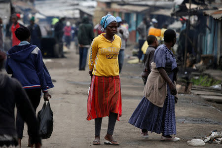 Residents walk on a busy street in Mathare slum, in Nairobi, Kenya, August 15, 2017. REUTERS/Siegfried Modola