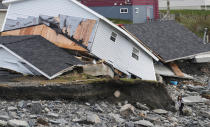 <p>Amy Osmond searches for her belongings in the aftermath of Hurricane Fiona in Port Aux Basques, Newfoundland, Canada September 26, 2022. REUTERS/John Morris REFILE - CORRECTING DATE</p> 