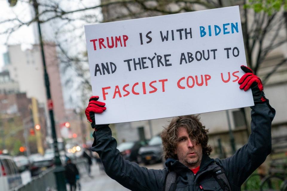 Maxwell Azzarello pictured protesting outside Donald Trump’s trial at Manhattan Criminal Court one day before self-immolating near the same location (Getty Images)