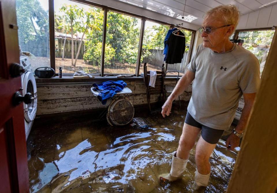 Seventy-five year-old Stewart Stafford, who lives on Southwest 28th street in the Edgewood neighborhood in Fort Lauderdale, stands in his still-flooded laundry room on Friday, April 14, 2023.